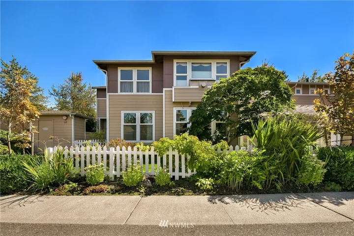 Highland Village. Charming picket fence and lots of beautiful landscaping. Corner lot gives you additional privacy.