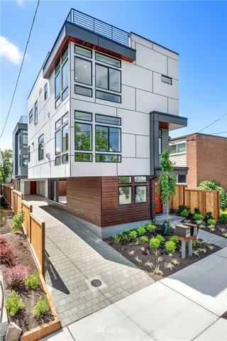 Dramatic high end home with rich finishes and top quality features. Notice the generous use of cedar planking on the exterior.