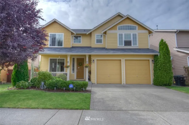 Curb appeal with a cheerful yellow home!