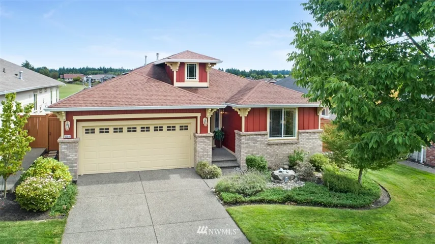 Popular Woodlands Floor plan situated on 2 fairways with Mt Rainier View! Spacious back yard with large patio. Private entry foyer, laminate flooring thru living rm/dining. Kitchen w/ island and granite tile counter tops w/ full stone back splash. White appl. Newer microwave. Raised panel cabinetry and raised bar off dining/kitchen w/pendant lighting. Stone fireplace with mantle. Deep sink in laundry. Master has walk in shower with benches. Perfect down size home with DEN! Jubilee a 55 plus active adult community with its own lodge.