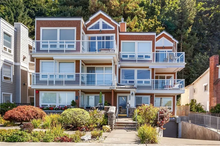 Welcome to Heron Watch Condominiums located at 1600 Alki Ave SW.  This adorable Cape Cod style condo is a favorite on Alki Beach with its eye catching landscaping and lovely shingled siding!  Here you will enjoy two garage parking spots with storage, an elevator and an entertaining size view deck.