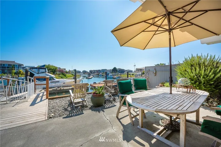 Living the good life! Views from the patio overlooking the Sandy Point Harbor. Enjoy relaxing time with friends or just watching the boats come and go.