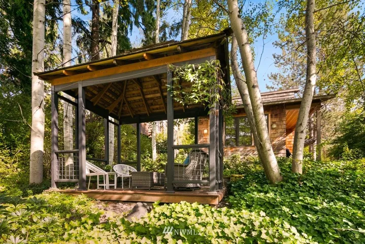 This desirable residence melds Craftsman styling with a cool tree house vibe and is tucked away in a lush arboreal and tranquil setting with Aspen trees, evergreens and low-maintenance plantings