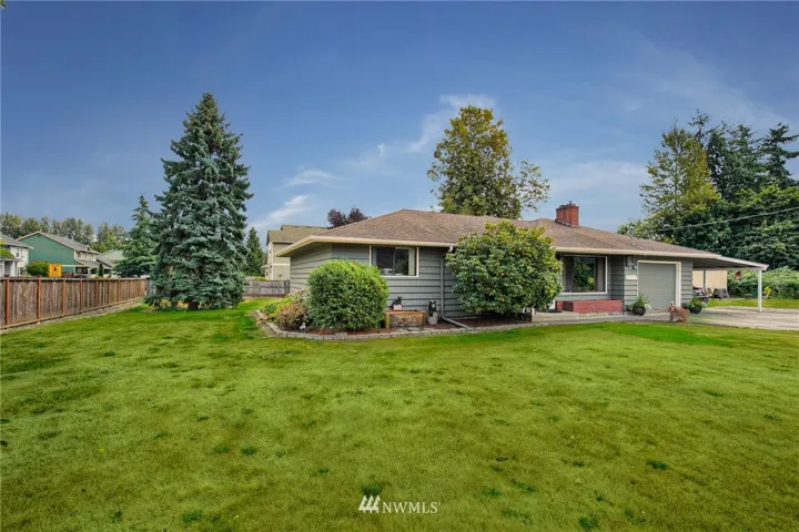 Four bedrooms (3 per septic design), huge great room, living room, spacious laundry room, attached garage and carport. Lots and lots to love about this house!
