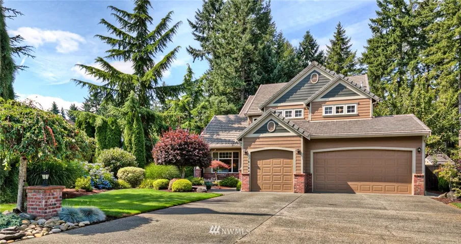 Exceptional landscaping and ample parking in this driveway.
