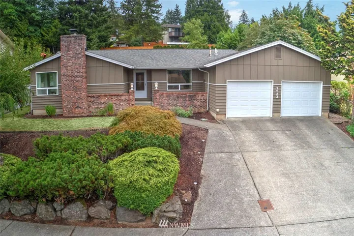 Welcome home to Talbot Hill! This 3 bedroom, 2 bath rambler has been beautifully updated to give it a true northwest feel. This home has a wonderful flow from the elegant entry to the expansive living room and open concept dining room which beckons you in with it’s large picture windows and wood-burning fireplace. The sleek, modern kitchen features two tone cabinets, quartz counters, luxury vinyl plank floors, stainless steel appliances, a modern subway tile back splash and a sizable pantry with updated white door. The kitchen is light and bright as it opens to the adjoining family room with breakfast bar. On the way to the tranquil master suite, you will pass two roomy guest bedrooms and a full bath.