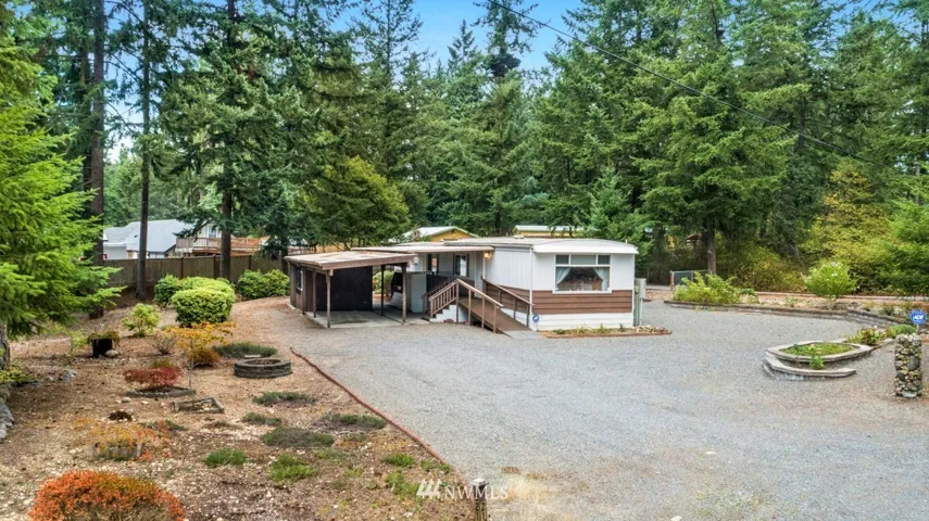 Over 1/2 acre (.56) of low maintenance landscaping, covered parking leading up to immaculate home!
