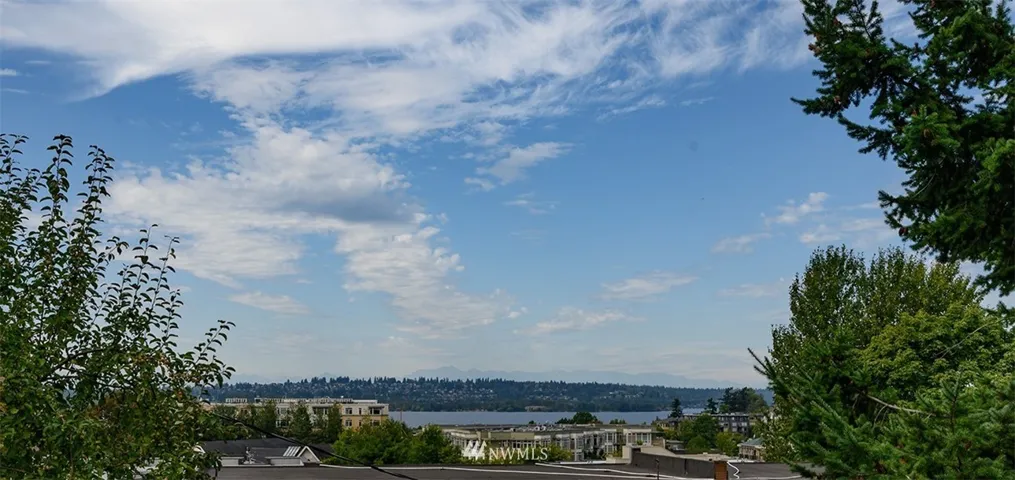 Welcome home to the well located TOP floor corner unit view  2 bed /2 bath condo in the heart of DT Kirkland.View from deck! Lake Washington and Olympics.