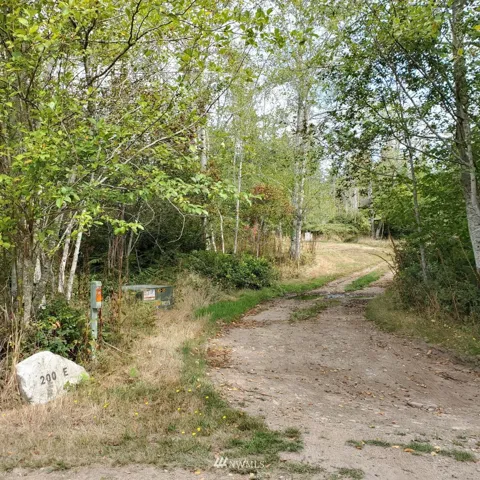 Driveway off Ritz with street number on rock.