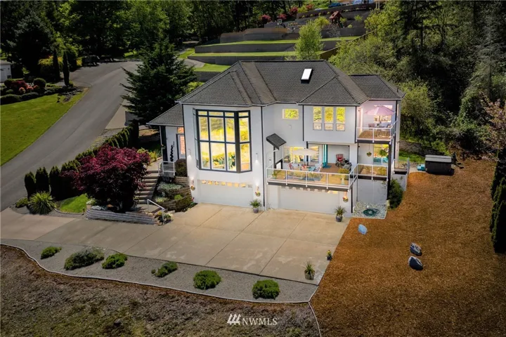 This stately single owner custom home has been meticulously maintained.  Elevated for full affect and to take in the territorial and Hale Passage Views.  Note the FOUR car garage!