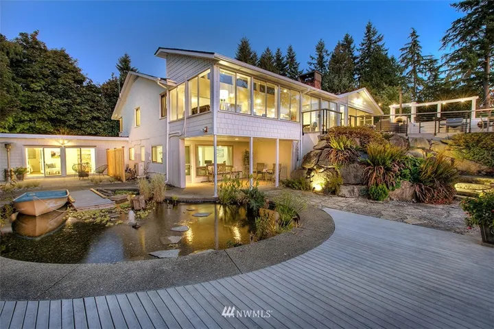 Welcome to the Normandy Park estate you have been dreaming of.  Many features, you just have to come see to believe.  Live pond with plant life, circulating pump and small water feature and as a lovely and fun addition is the mini dock and floating row boat!