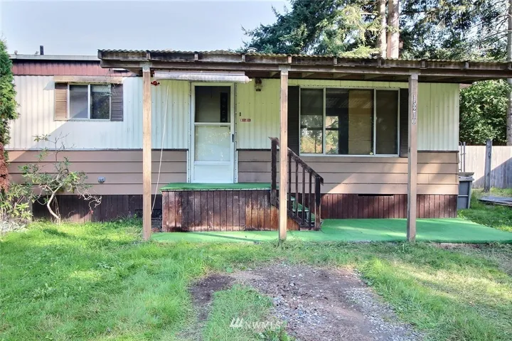 Front of the residence with covered front porch.