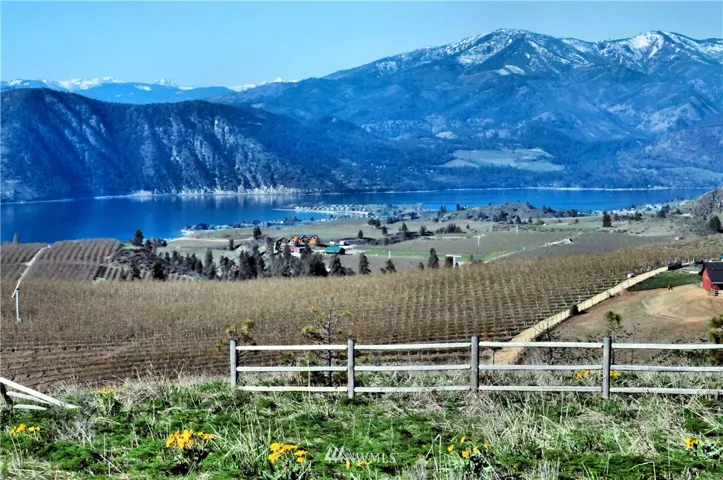 7+ acres - ready for your Lake Chelan dream home. Located in Chelan Trails - great community between Chelan and Manson.  Located in the heart of Lake Chelan Wine Country! This is a spring shot with lots of balsam root plants that have giant daisy like flowers!