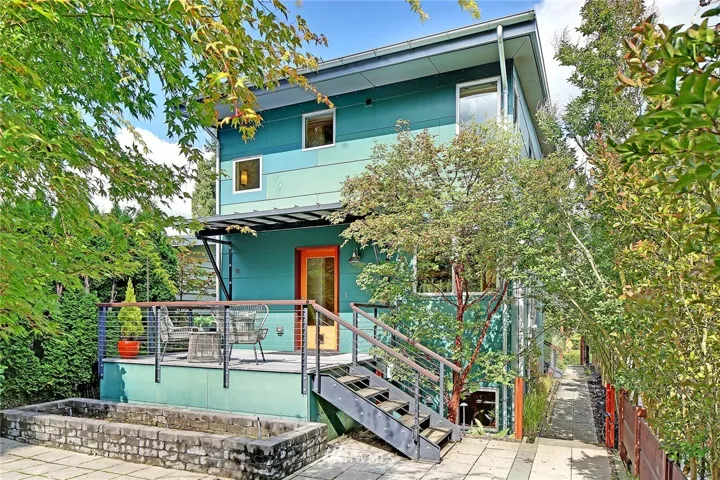 Your own in-city oasis awaits!  Enjoy your thoughtfully landscaped lot.  Pavers, drought tolerant plantings, rain garden, and garden roof all reduce the impact of water run-off.