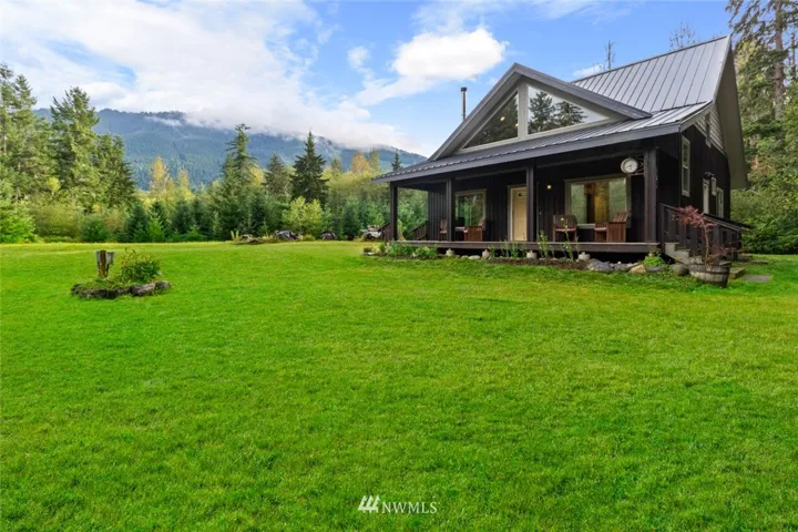 Front of House with sitting area over looking the mountains.