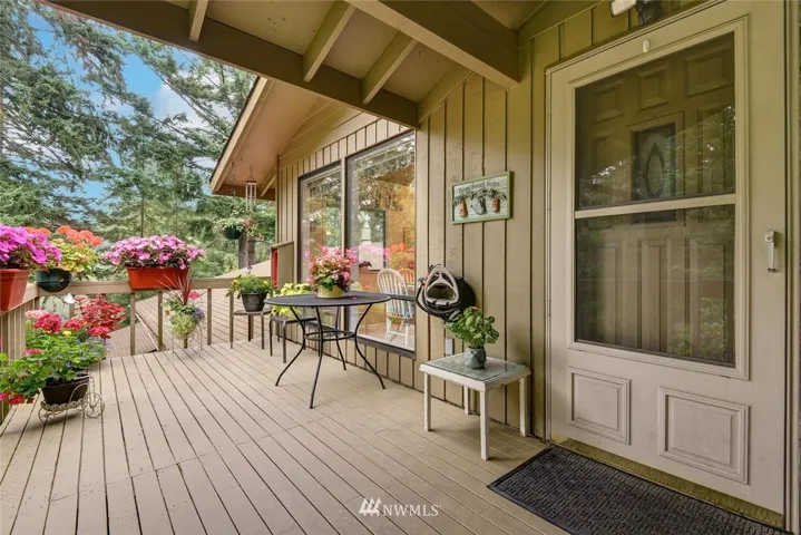 Situated in a setting of over 5+ acres of lush greenery, the entrance deck of unit is serene and private.