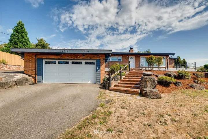 Set high above the street with RV parking and lots of additional parking in front of the attached two-car garage.