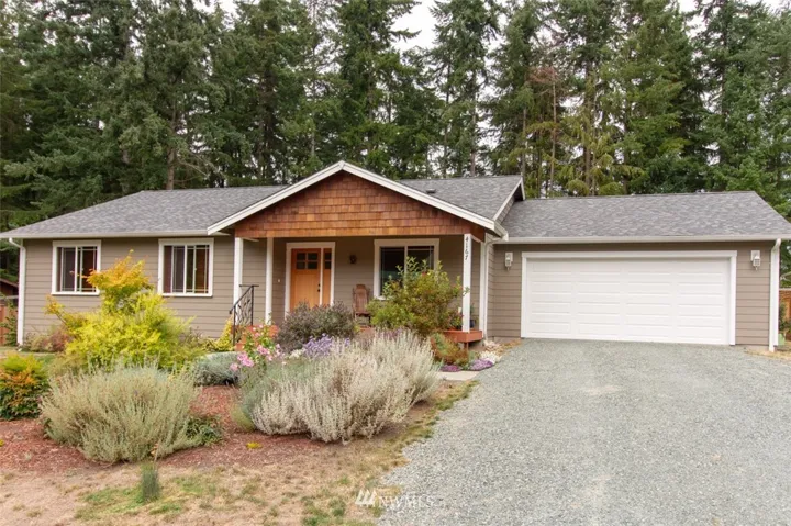 Front view of house, driveway, and garage