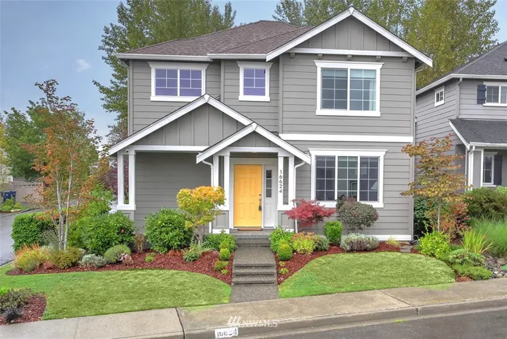 Welcome home to the lovely community of  Woodside. This 3 bedroom, 3 bath home is sure to please. The covered front porch is a great place to sit and relax. You’ll be drawn in by the tall ceilings, architectural columns, abundant windows and open floorplan. This home is a welcoming gathering place, with open sightlines between the living room, dining room and kitchen, boasting stainless steel appliances, an island with seating and large pantry. From here, step out to to a large patio and charming, fully fenced backyard featuring raised garden beds and an  apple tree.