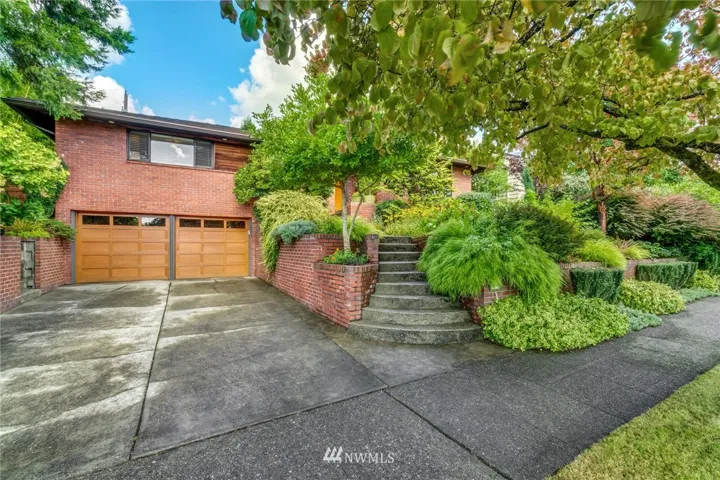 Welcome to 4544 Purdue Ave NW located in the heart of coveted Hawthorne Hill's Neighborhood.  Quiet tree lined street just steps away to the Burke Gilman Trail.  With its big double car attached garage and wide level driveway, there's plenty of off street parking for you and your guests.