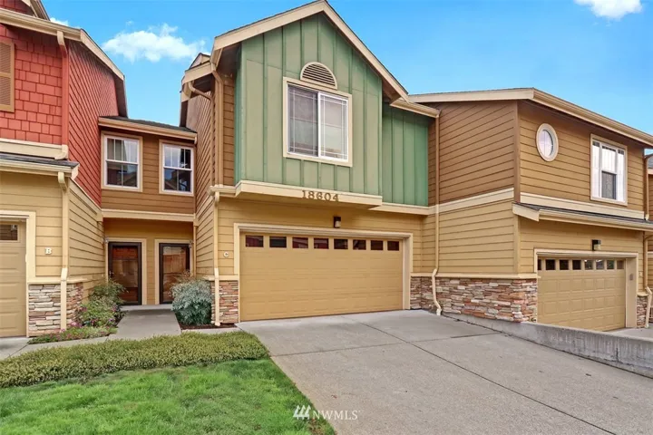 Beautiful and move-in ready condo with 2 car garage and 2 additional parking spots in driveway!