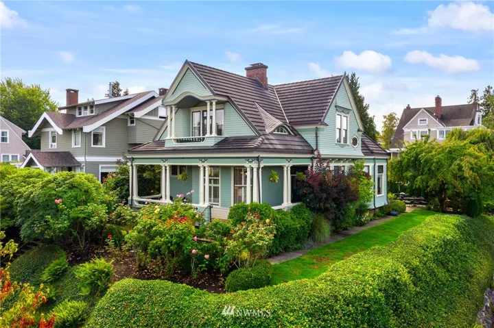 Perched above the corner of 6th and E St on perfectly manicured grounds, this Victorian awaits!