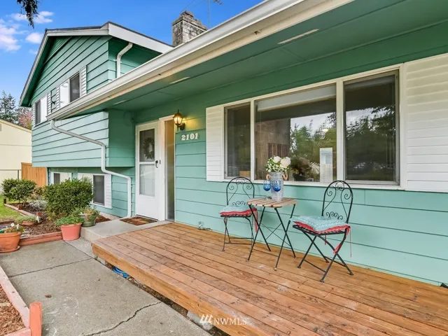 FRONT OF HOUSE WITH WELCOMING FRONT PORCH