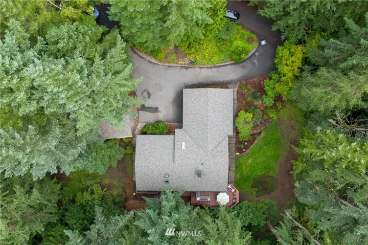 Large 2.6 acre wooded lot with main level living in the heart of Gig Harbor!
