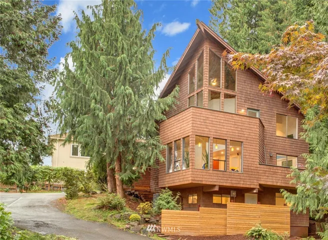 Welcome home! This beautiful Pacific Northwest Contemporary home is nestled in nature with three bedooms, 2.5 baths and loads of multi-level living space.