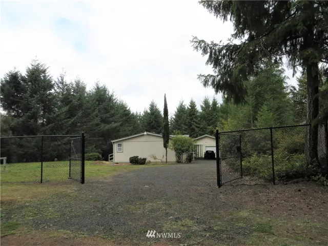 Nicely fenced and gated front exterior