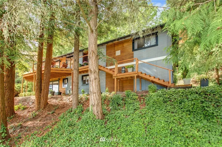 Home sits high in 'TREE-TOP" setting.  Private & quiet.  Upper level main living area with vaulted ceilings & tons of natural light!  Plus: Huge protected green-belt behind home ideal for playing & sledding when the snow hits!                       Shy 18,000 foot huge lot!  Evergreens, trails & more.