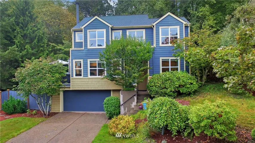Great shot of the front of this beautiful home. So peaceful at the end of this tree lined street!