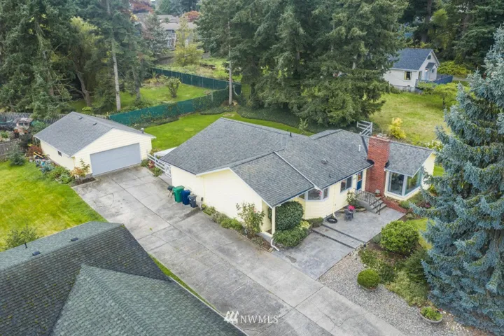 Welcome to your new home, where you can spread out on your 1/3+ acres, shop and all.
