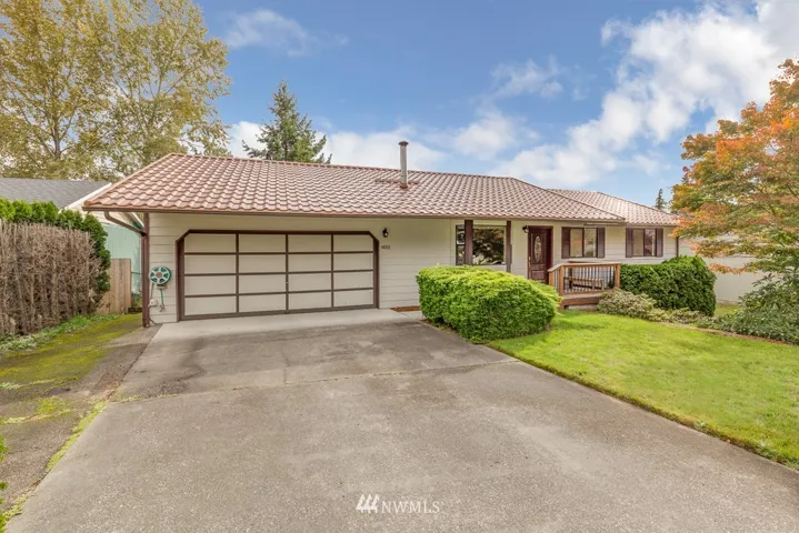 Well-kept with curb appeal and plenty of parking with the two car garage and paved driveway.