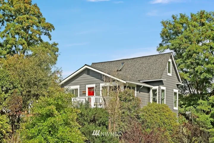 Perched on a corner lot just a few blocks from the shops and restaurants on  Madison Ave. New exterior paint in 2018 and new roof in 2016.