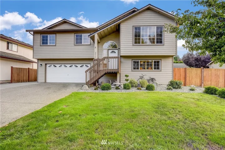 Front of house.  Tons of parking with RV parking to left and right of house.