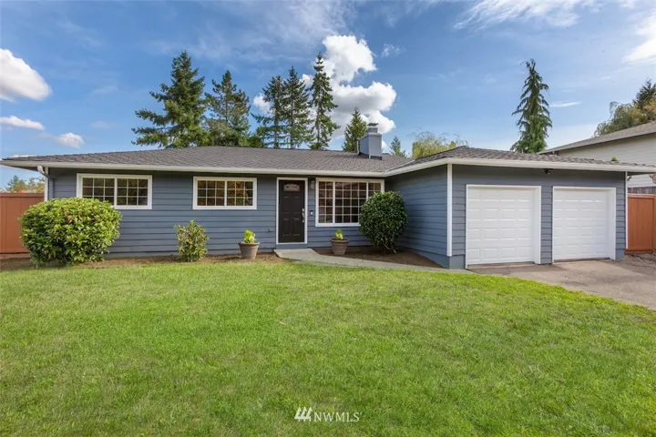 Peacefully situated in the delightful Woodford neighborhood near Grass Lawn Park, this home boasts pleasing appeal from the curb with a presidential roof, gridded windows, and new garage doors.
