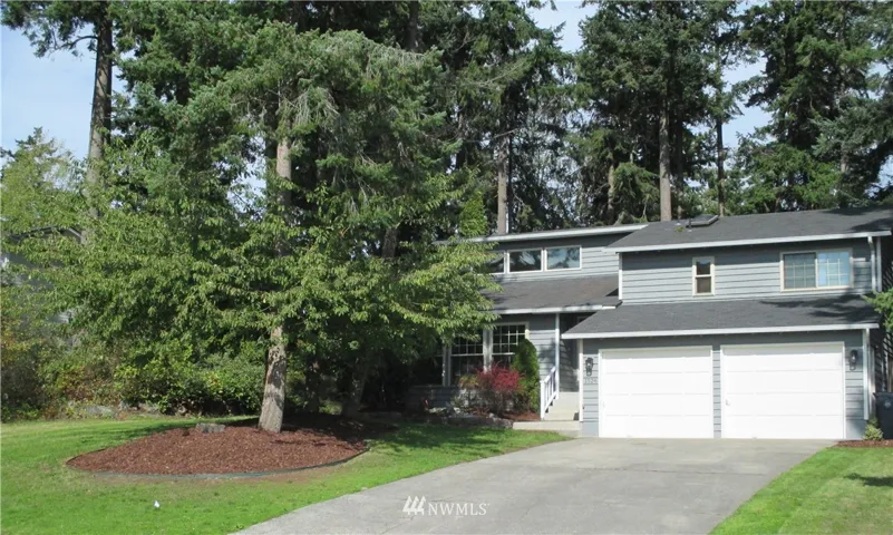Picture yourself and your loved ones in this spacious home ...all you have to do is move in. All new carpeting, laminate flooring , and wide trim baseboard. Updated bathrooms.