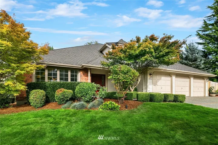 Honey stop the car! Enviable curb appeal comprises professional landscaping (with dramatic up-lighting), fresh exterior paint, and a TRUE 3-car garage with ample space for all the toys.