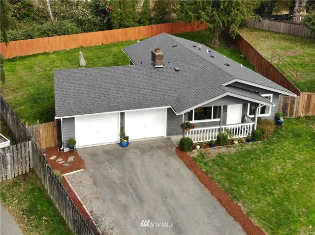 Arial of the entire property, lot is a quarter of an acre massive driveway and a tastefully fenced backyard entrance.