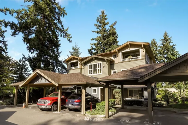 Beautiful setting with one carport spot and one open parking spot!