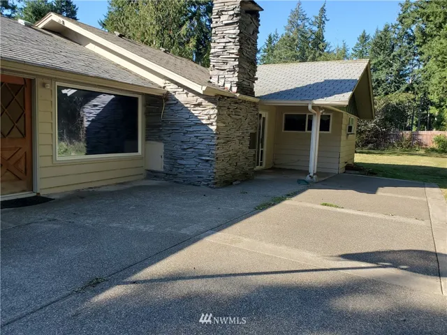 Stunning back deck.. with a nice fire place built in!