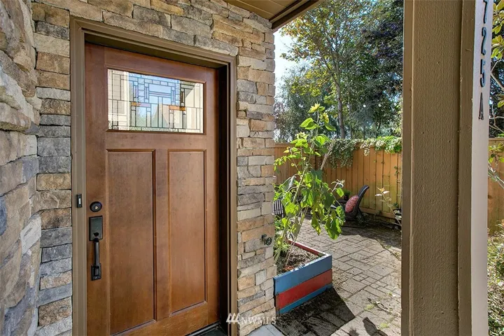 Standalone corner unit with private gated access, yard and 2 car garage. Just wait... there's more..