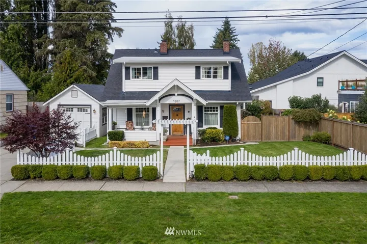 Beautiful home with classic white paint and black trim. You'll appreciate the easy maintenance vinyl siding.  House faces south.