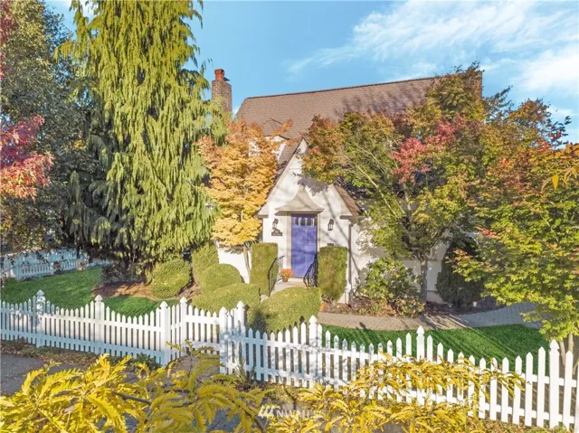 Surrounded by the white picket fence, and set off by the charming purple door, this home is located blocks from UPS, 6th Avenue business district, Proctor riches!