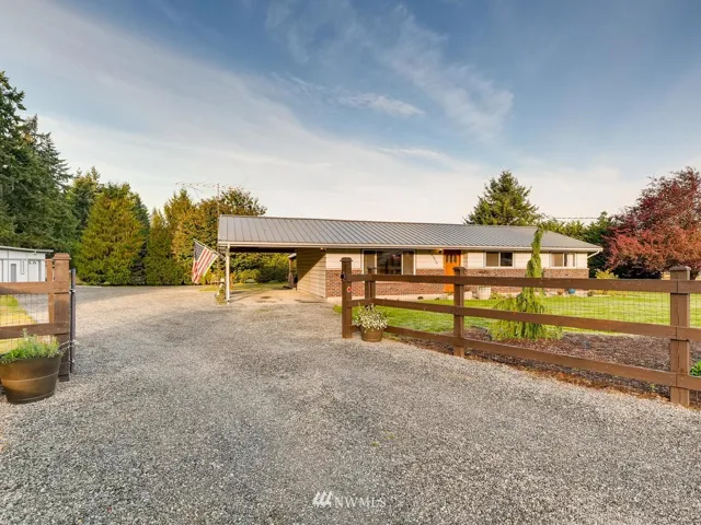 You are going to LOVE this cozy rambler on level, fenced, gated acreage with a shop that has additional finished space in it for whatever your needs are.