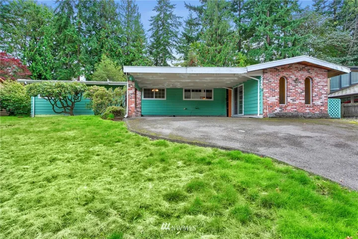 Front of home. Large 2 car carport