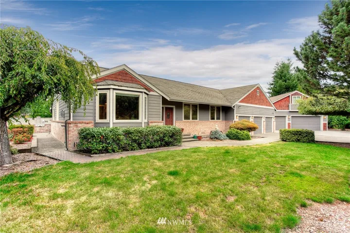 Yearning for space?...welcome to this gated 8.7 acre Edgewood property boasting a spacious updated rambler and multiple outbuildings.