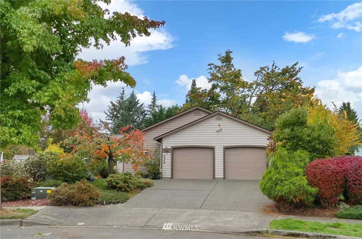 Tucked back in a cul de sac, this 3 bedroom 2 bath 2031 sf Rambler is a gardener's paradise!