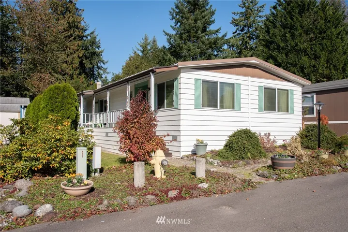 This home is in a particularly great location in the park. It sits up above most the other homes.There's views of sunsets and on a clear day when the "Mountain is out" you can see Mount Rainier.
